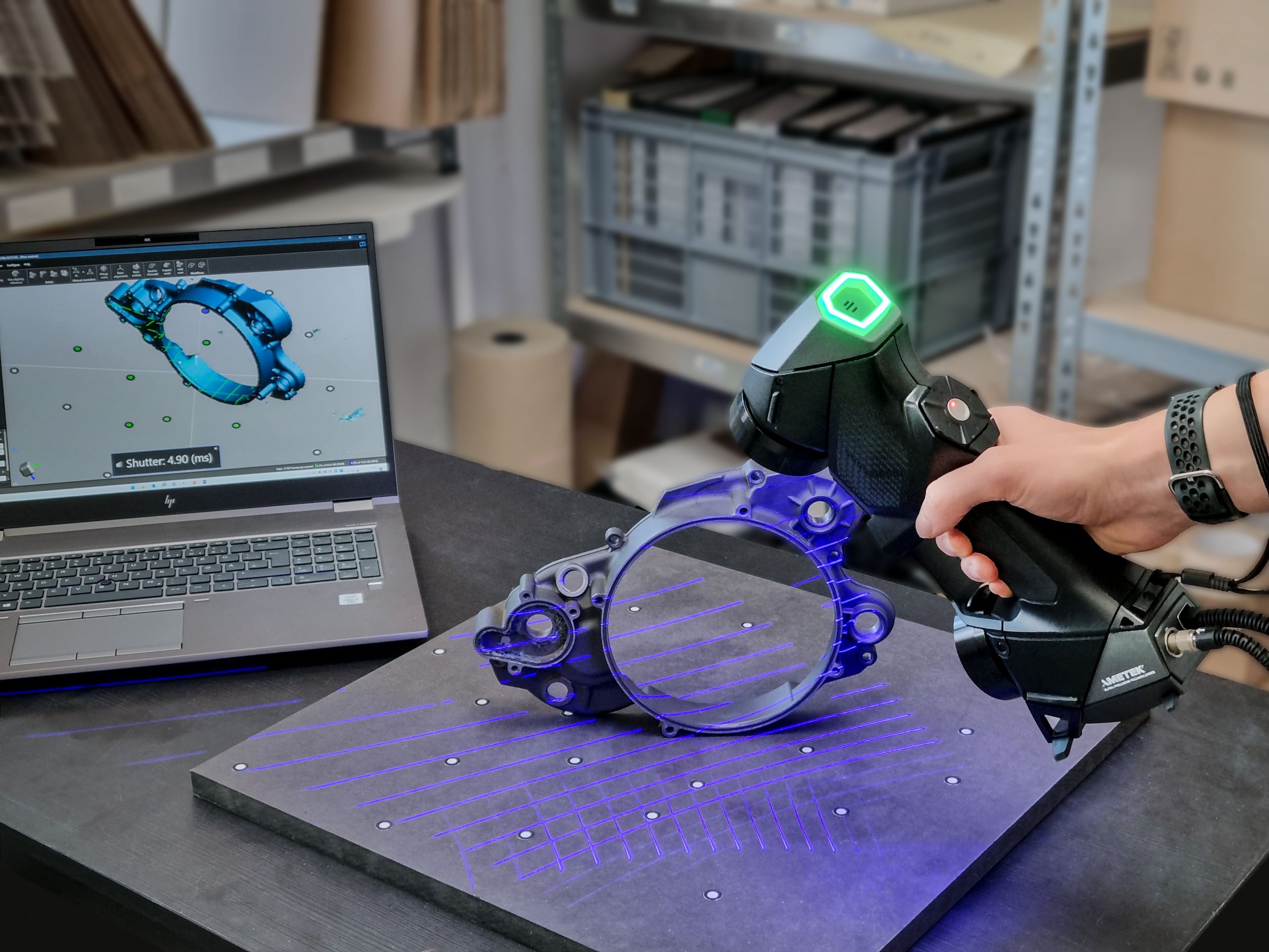 Handheld 3D scanner capturing a part