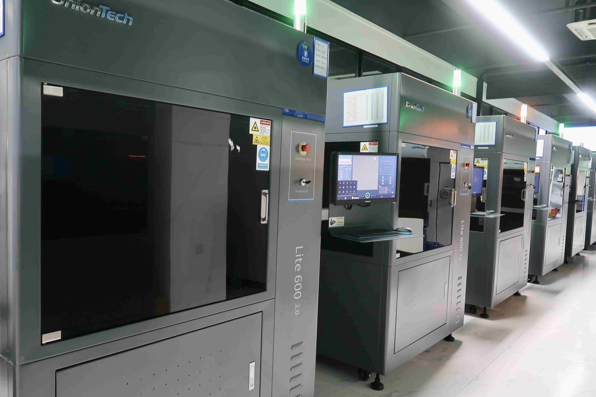 Industrial SLS 3D printers on the production floor